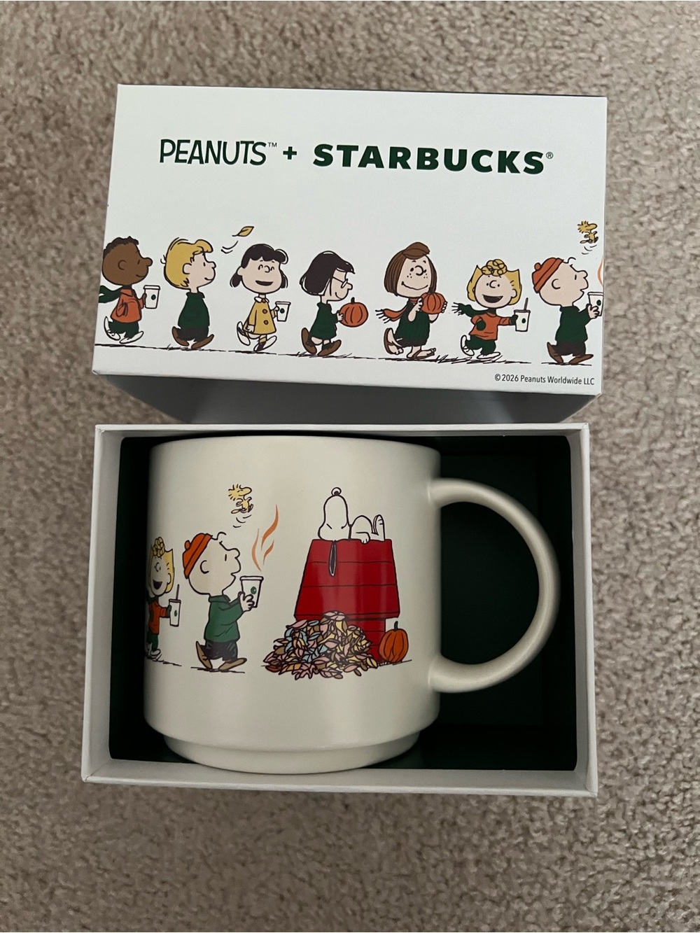 Holiday-themed mug (Peanuts x Starbucks)